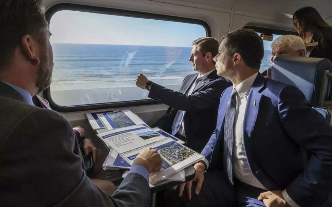 U.S. transportation secretary rides train on eroding Del Mar bluffs